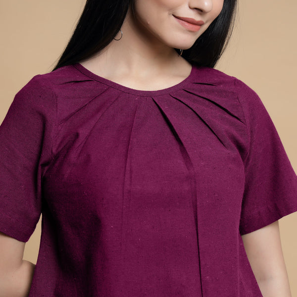 Front Detail of a Model wearing Magenta Pleated Neck A-Line Top
