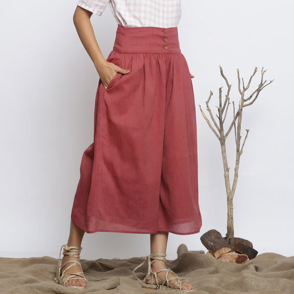 Right View of a Model wearing Maroon Handspun Flared High-Rise Pant