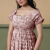 Front Detail of a Model wearing Maroon Shibori Elasticated Gathered Dress