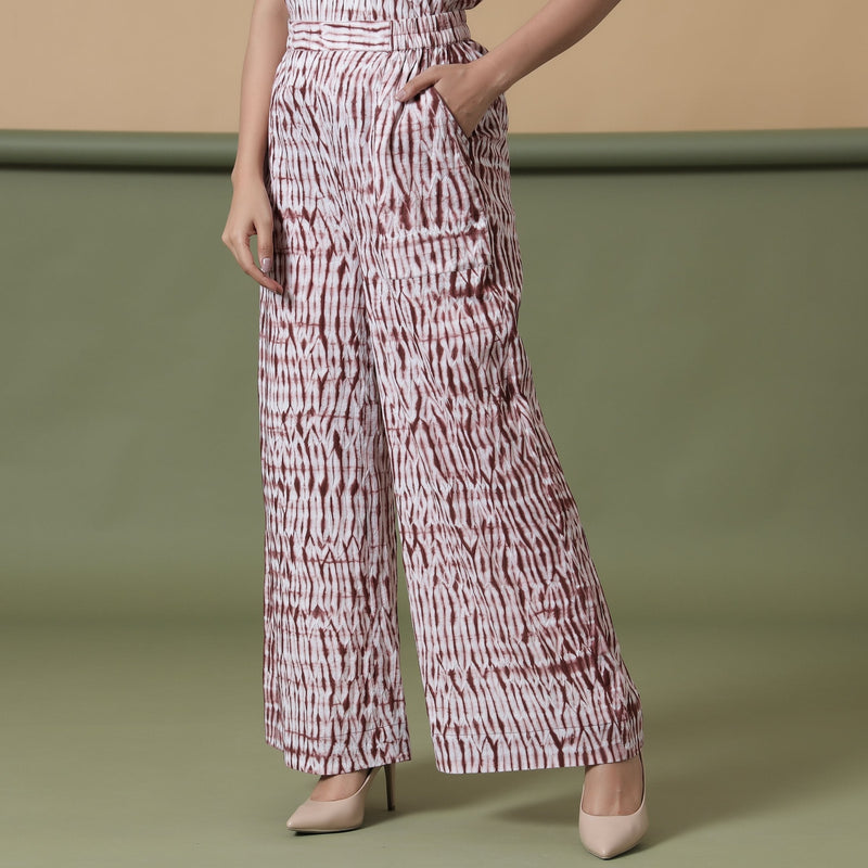 Left View of a Model wearing Maroon Shibori Tie-Dye Cotton Elasticated Wide Legged Pant
