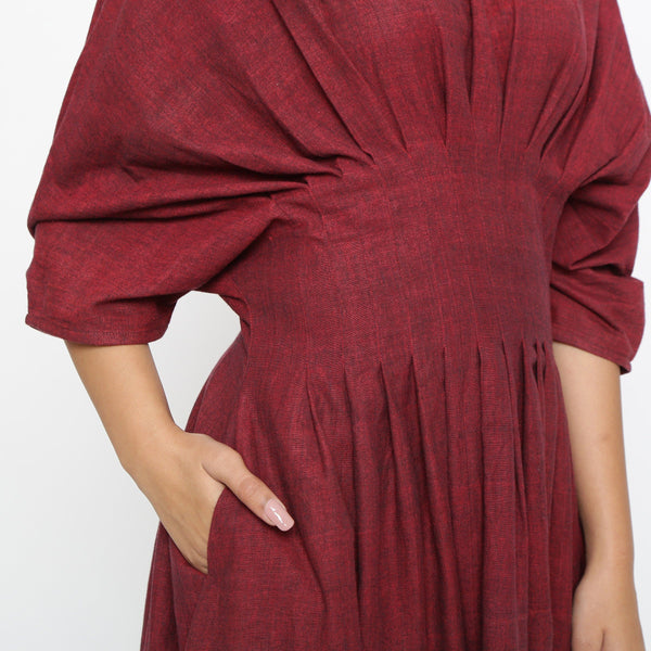 Front Detail of a Model wearing Maroon Solid Boat Neck Flared Dress