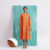 Front View of a Model wearing Melon Orange Comfort Fit Mirror Work Dress