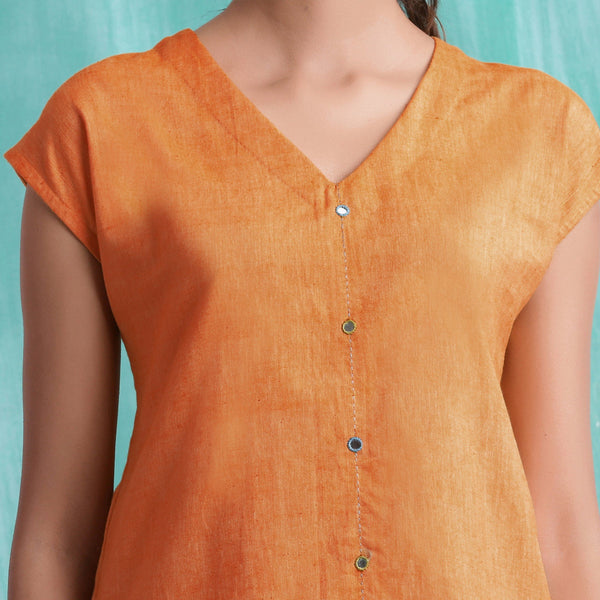Front Detail of a Model wearing Melon Orange Mirror Work Drop Shoulder Top