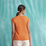 Back View of a Model wearing Melon Orange Mirror Work Drop Shoulder Top