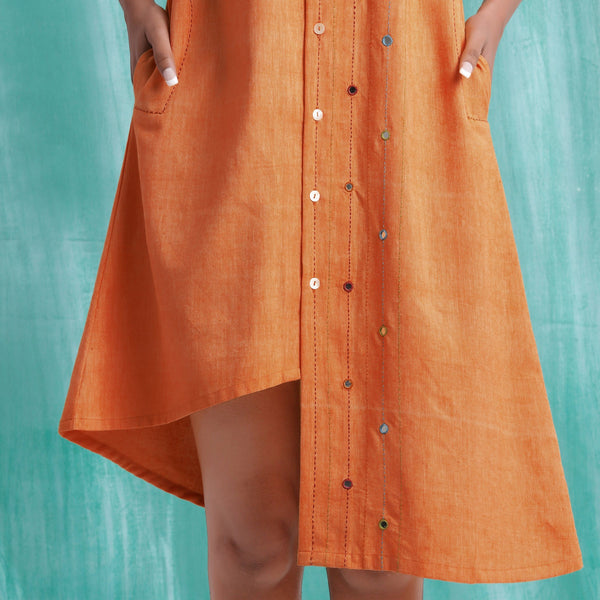 Close View of a Model wearing Melon Orange Mirrored Asymmetrical Shirt Dress