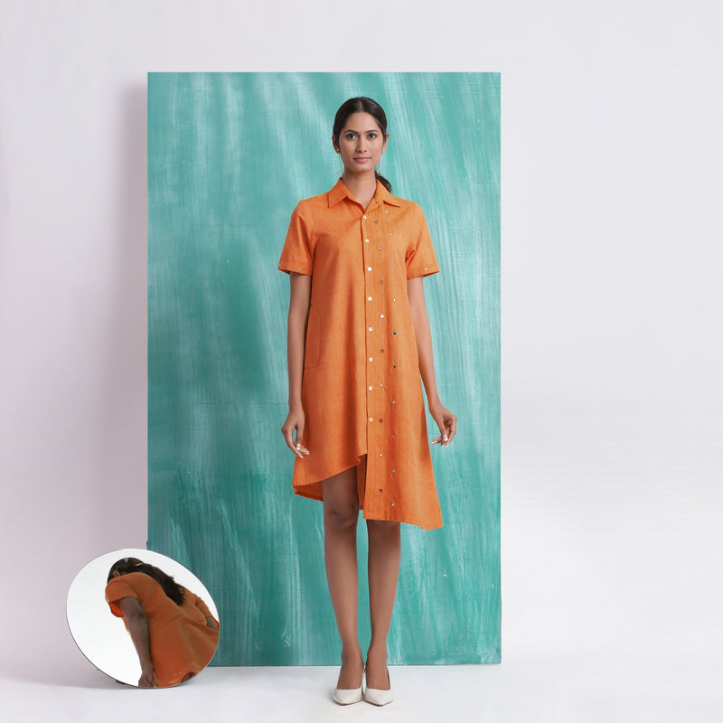 Front View of a Model wearing Melon Orange Mirrored Asymmetrical Shirt Dress