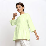 Right View of a Model wearing Mint Green Cotton Button-Down Top