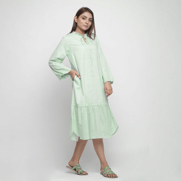 Right View of a Model wearing Mint Green Cotton Chambray Midi Dress