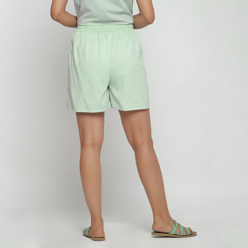 Back View of a Model wearing Mint Green Cotton Chambray Shorts