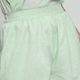 Front Detail of a Model wearing Mint Green Cotton Chambray Shorts