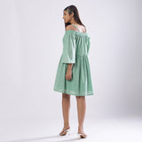 Back View of a Model wearing Green Off-Shoulder Fit and Flare Dress