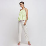 Front View of a Model wearing Mint Green Top and White Tapered Pant Set
