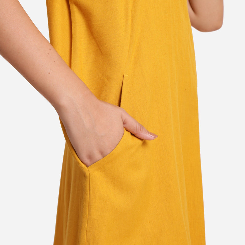 Right Detail of a Model wearing Mustard Cotton Flax Anti-Fit Dress