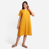 Front View of a Model wearing Mustard Cotton Flax Anti-Fit Dress