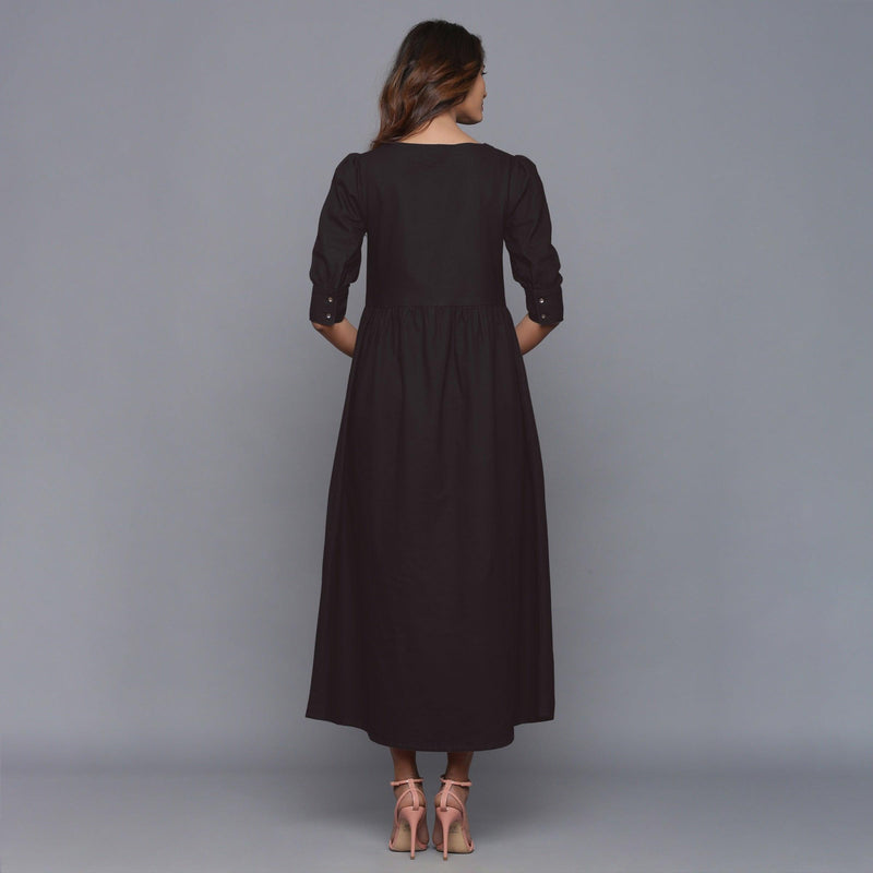 Back View of a Model wearing Moonlight Black Cotton Flannel Gathered Dress
