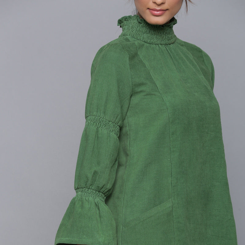 Front Detail of a Model wearing Moss Green Corduroy High Neck Dress