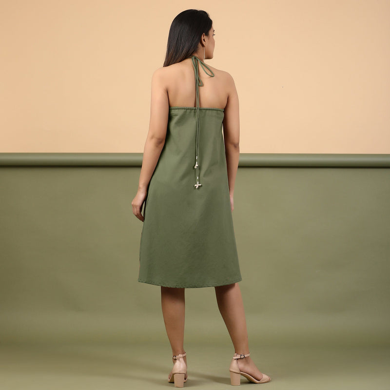 Back View of a Model wearing Moss Green Shibori Halter Neck A-Line Dress