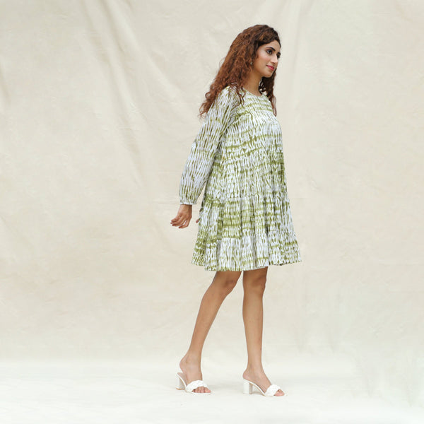 Right View of a Model wearing Moss Green Shibori Tie-Dye Cotton Tier Short Dress