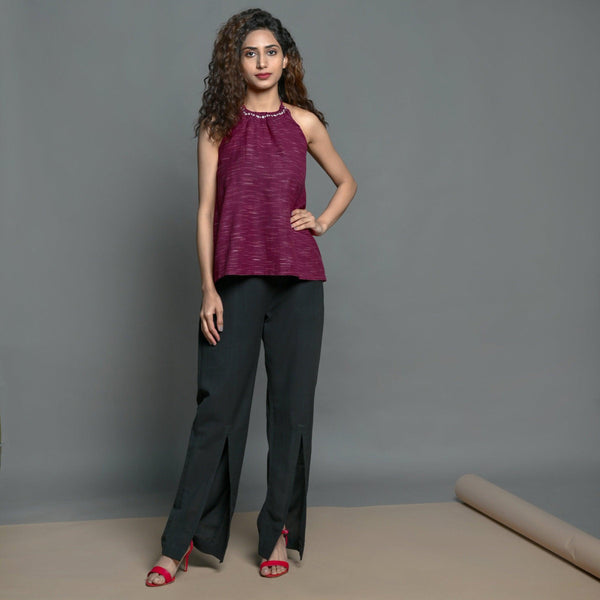 Front View of a Model wearing Mulberry Halter Top and Black Slit Pant set