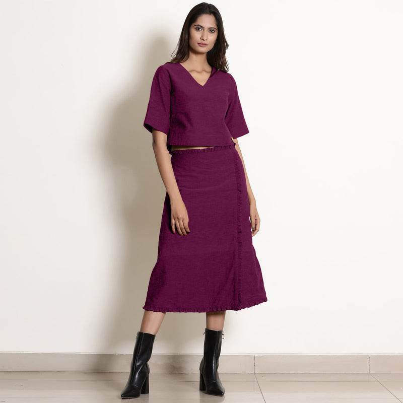 Front View of a Model wearing Mulberry Wrap Top and A-Line Skirt Set