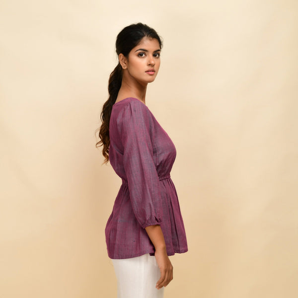 Right View of a Model wearing Mulberry Yarn Dyed Handspun Cotton Round Neck Peplum Top