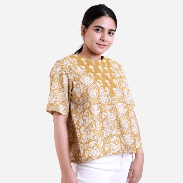 Right View of a Model wearing Mustard Bagru Block Print Cotton Flared Top