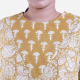 Front Detail of a Model wearing Mustard Bagru Block Print Cotton Flared Top