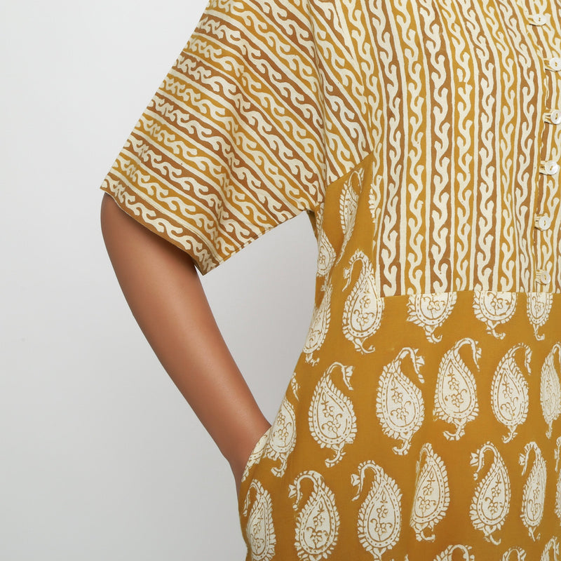 Front Detail of a Model wearing Mustard Block Printed Cotton Ankle Length Snug Dress
