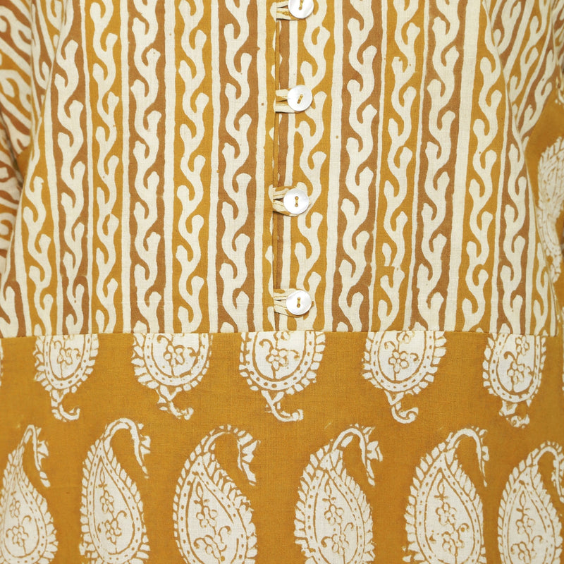 Front Detail of a Model wearing Mustard Block Printed Cotton Ankle Length Snug Dress