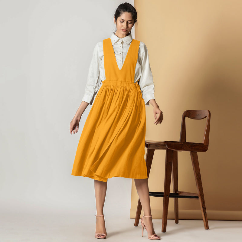 Front View of a Model wearing Mustard Cotton Flax Pinafore Midi Wrap Dress