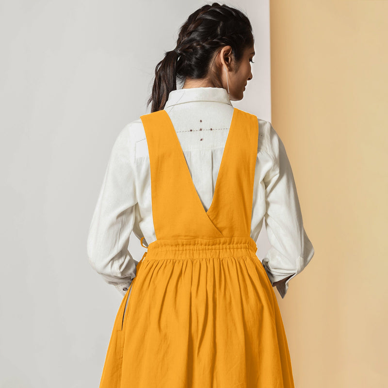 Back View of a Model wearing Mustard Cotton Flax Pinafore Midi Wrap Dress