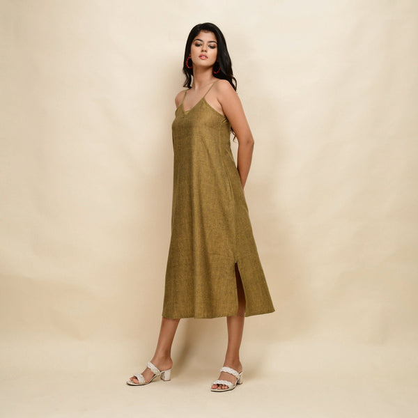 Left View of a Model wearing Mustard Gold 100% Cotton Khadi A-Line Dress