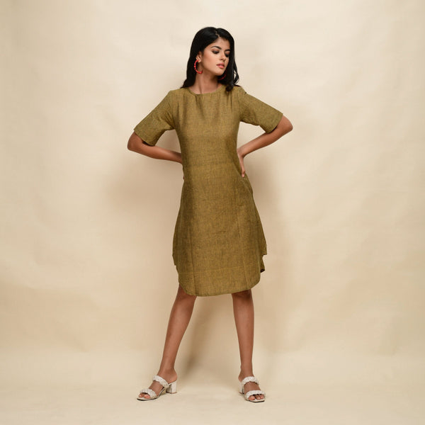 Front View of a Model wearing Mustard Gold 100% Cotton Knee Length Dress