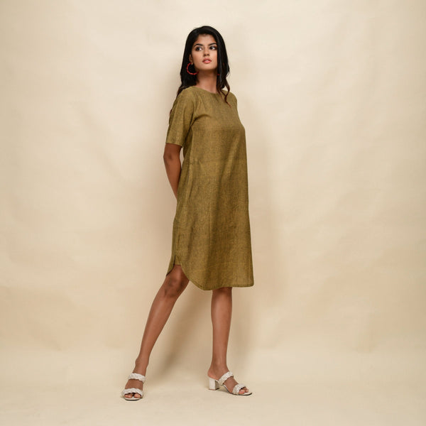Right View of a Model wearing Mustard Gold 100% Cotton Knee Length Dress