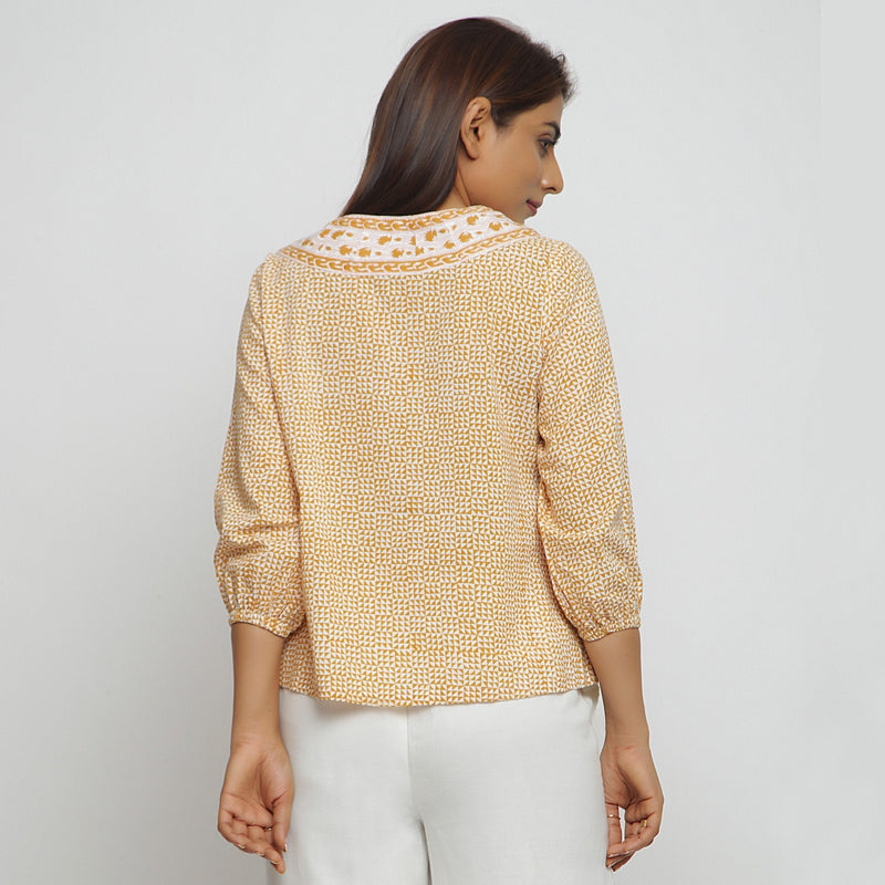 Back View of a Model wearing Mustard Ditsy Block Printed Cotton Straight Top
