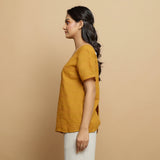 Left View of a Model wearing Mustard Cotton U-Neck Straight Top