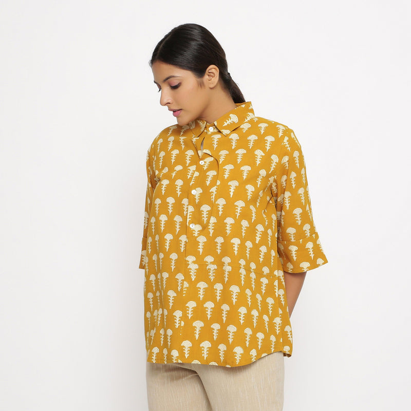 Left View of a Model wearing Mustard Block Printed Button-Down Shirt
