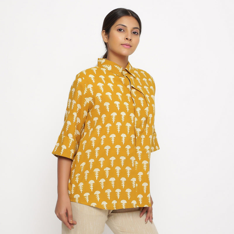 Right View of a Model wearing Mustard Block Printed Button-Down Shirt
