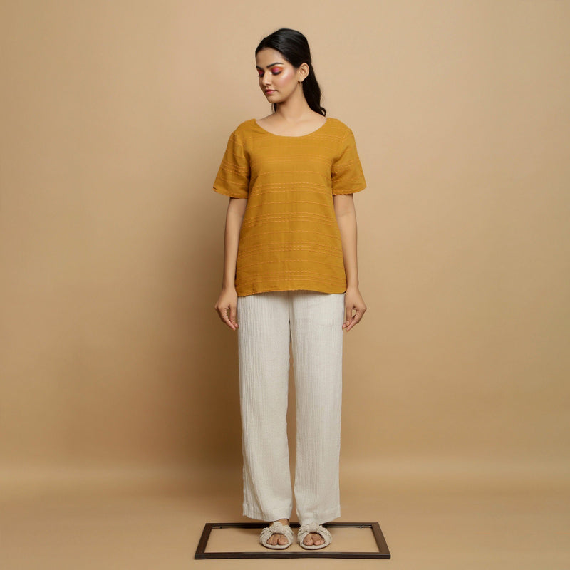 Front View of a Model wearing Mustard U-Neck Top and Elasticated Ecru Pant Set