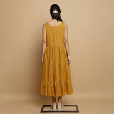 Back View of a Model wearing Mustard V-Neck Handwoven Tier Dress