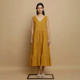 Front View of a Model wearing Mustard V-Neck Handwoven Tier Dress