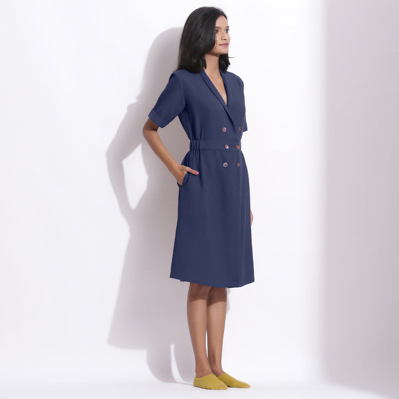 Right View of a Model wearing Navy Blue Cotton Waffle Knee Length Coat Dress