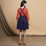 Back View of a Model wearing Navy Blue Cotton Flax Knee Length Criss-Cross Back Dress