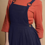 Front Detail of a Model wearing Navy Blue Cotton Flax Knee Length Criss-Cross Back Dress