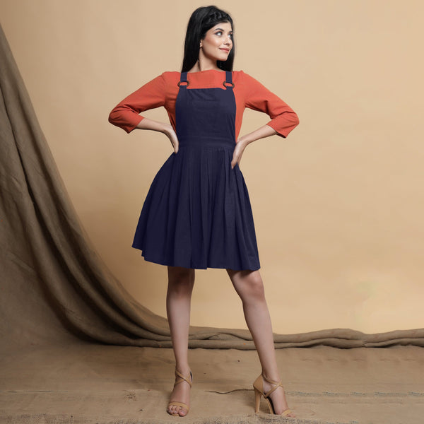 Front View of a Model wearing Navy Blue Cotton Flax Knee Length Criss-Cross Back Dress