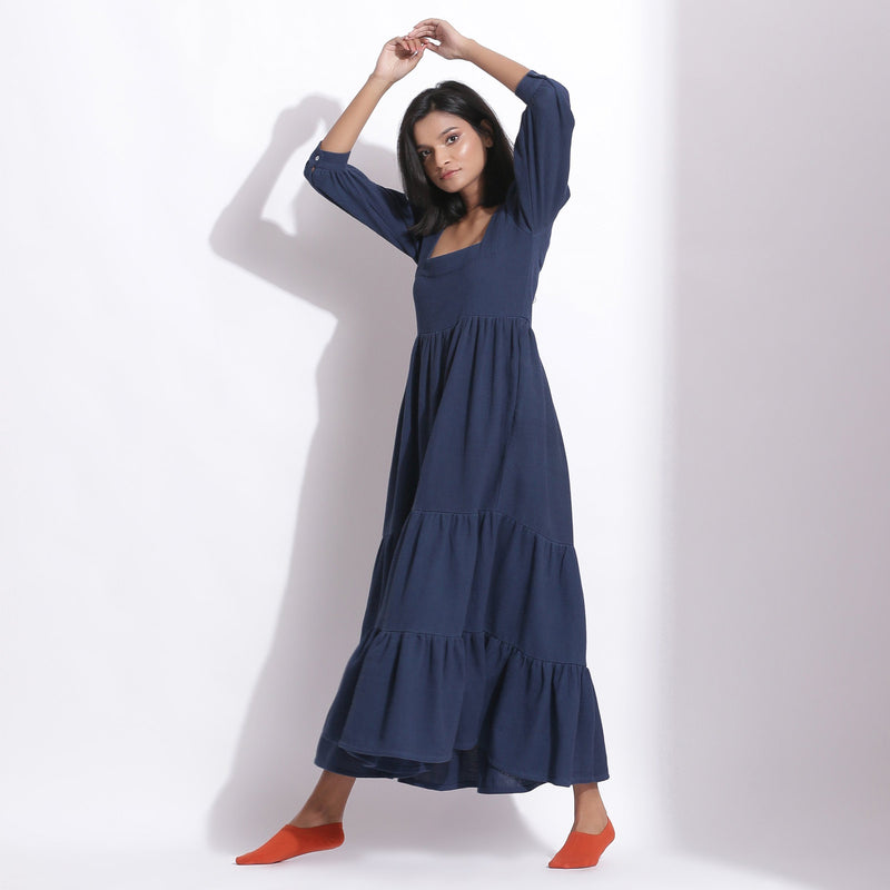 Left View of a Model wearing Navy Blue Cotton Waffle Tier Maxi Dress
