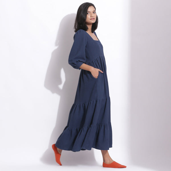 Right View of a Model wearing Navy Blue Cotton Waffle Tier Maxi Dress
