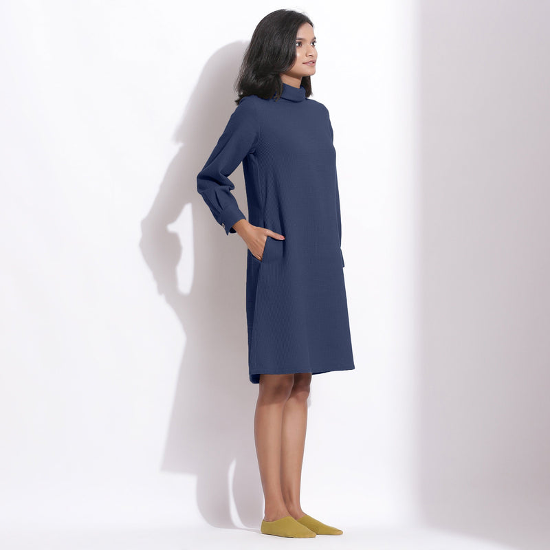 Right View of a Model wearing Navy Blue Cotton Waffle Turtleneck Dress