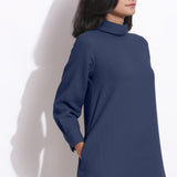 Front Detail of a Model wearing Navy Blue Cotton Waffle Turtleneck Dress