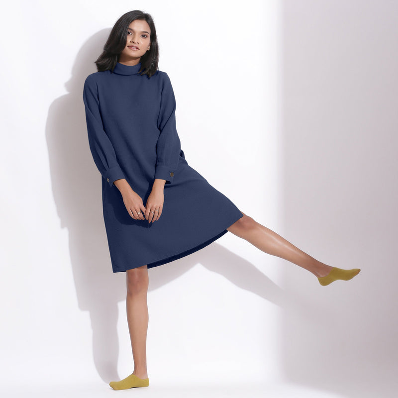 Front View of a Model wearing Navy Blue Cotton Waffle Turtleneck Dress